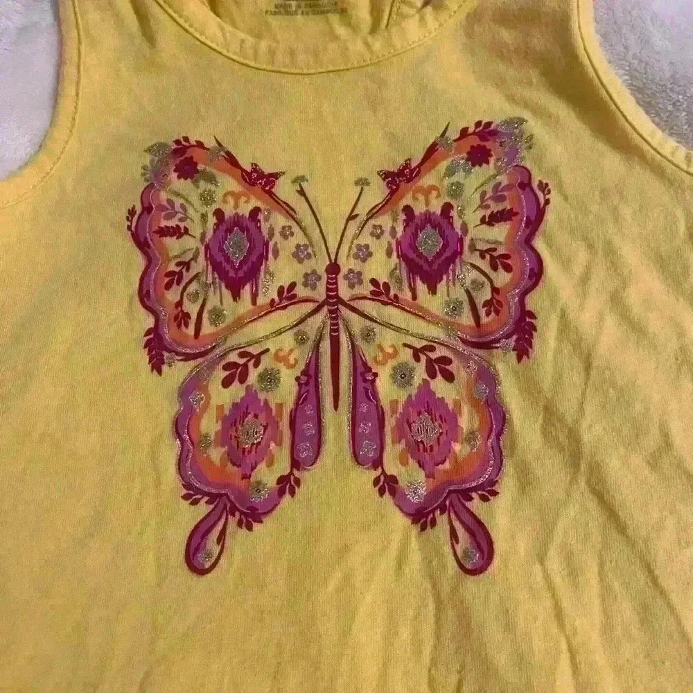 Girls Razorback tank in yellow with glittery butterfly in pink & orange size S/P